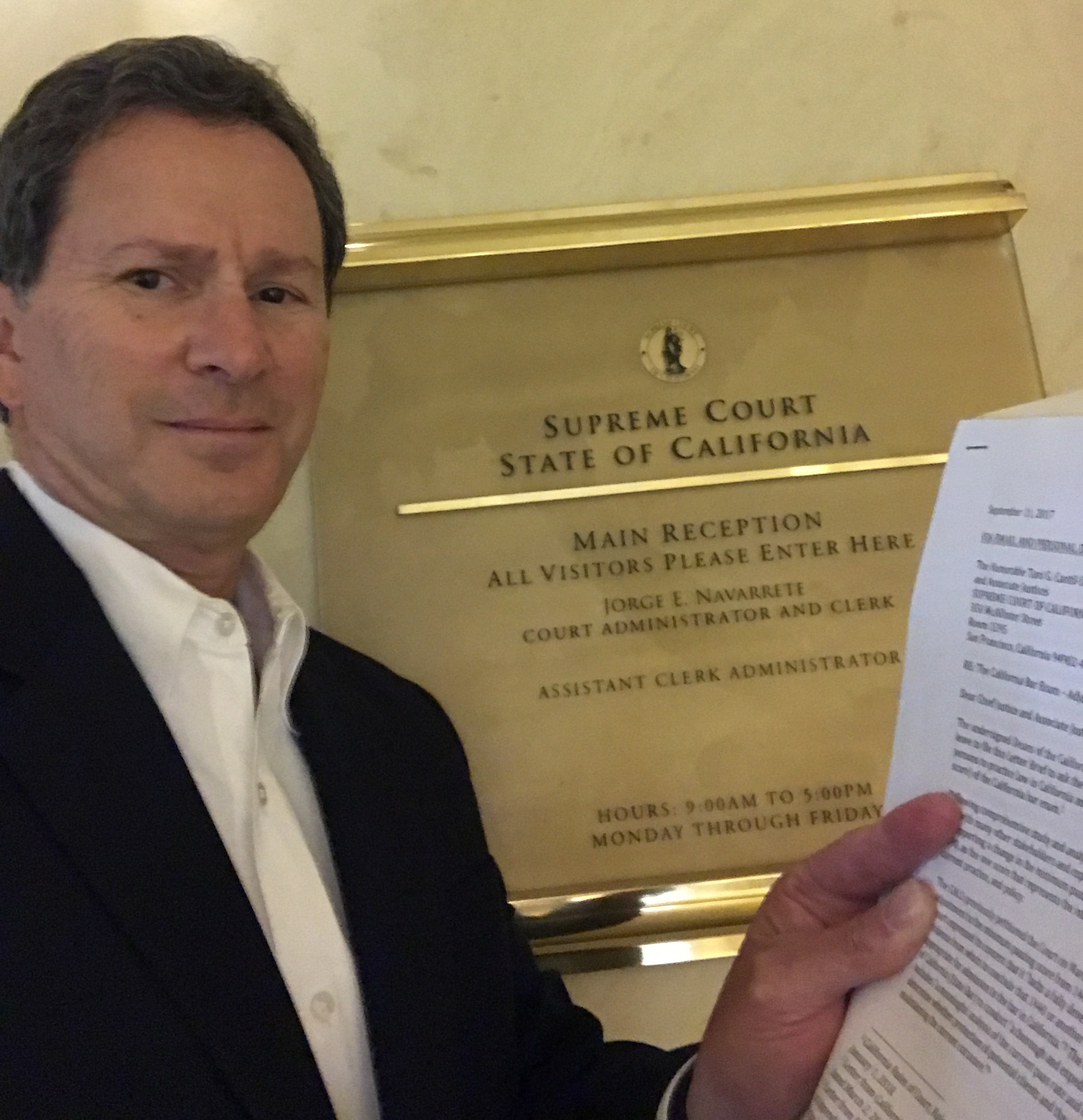 Dean in front of Supreme Court sign